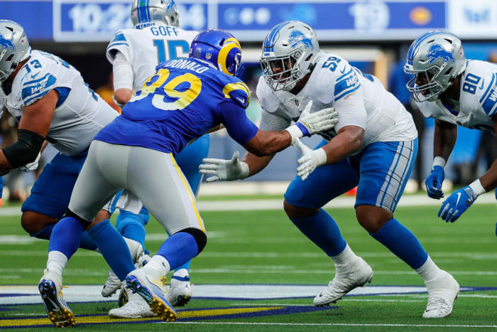 Penei Sewell (58) tries to block Los Angeles Rams defensive end Aaron Donald